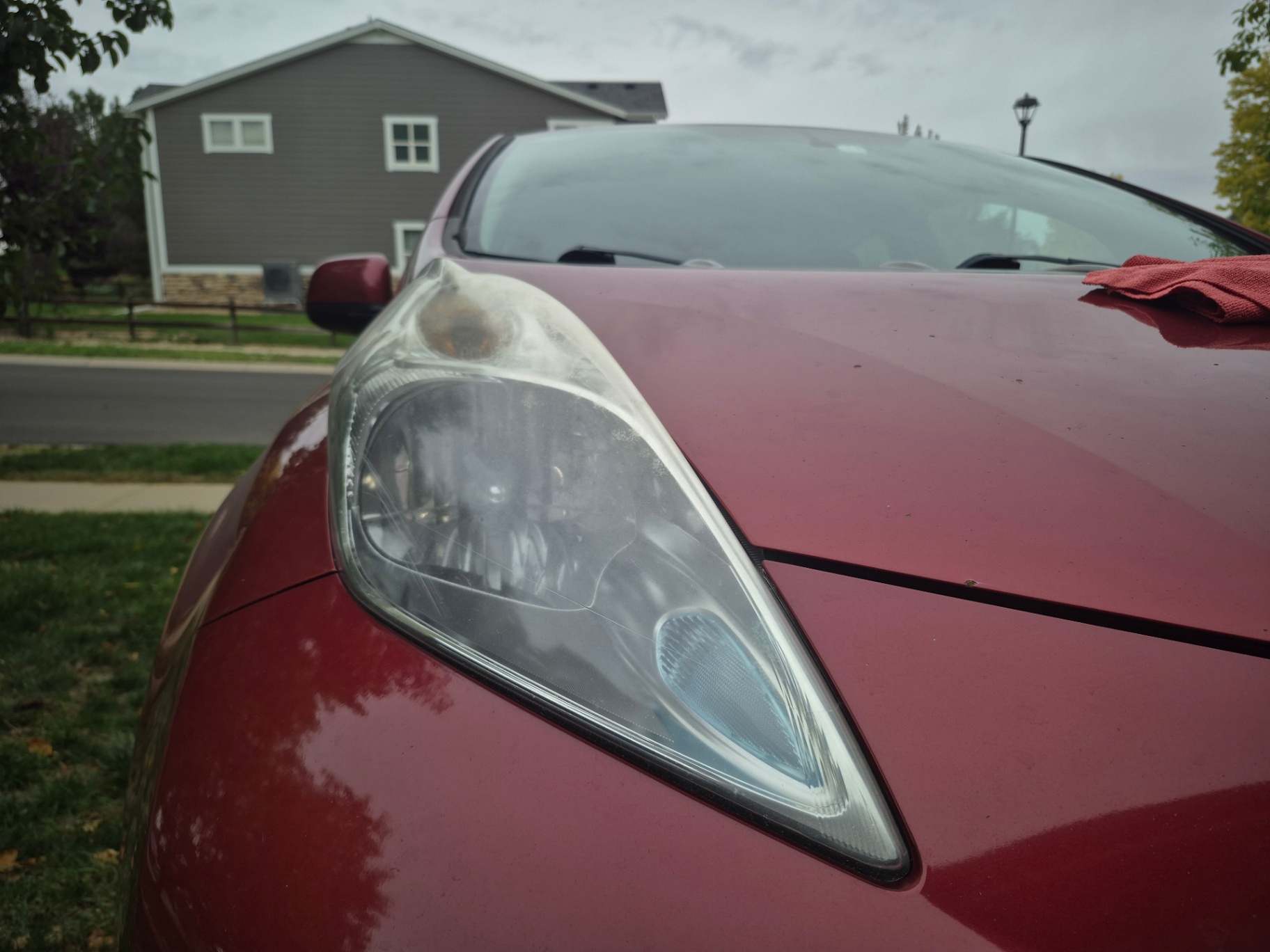 2015 Nissan Leaf oxidized headlight before restoration